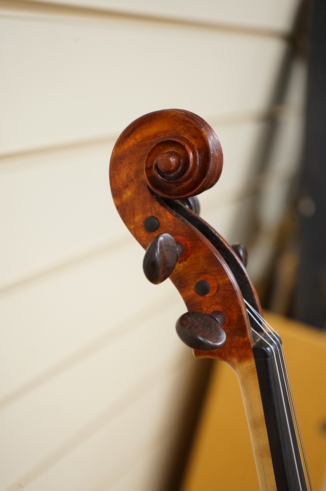 Three violins; a late 19th century German Stradivarius pattern violin, without label, a handmade violin (a.f.), with sound post crack, broken and repaired scroll, etc. and a Maidstone violin body, varnish stripped from t